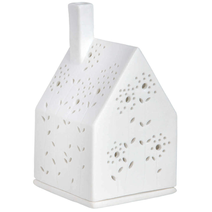 Maison lumineuse fleurie Räder en porcelaine blanche avec découpes prairie et bougie chauffe-plat