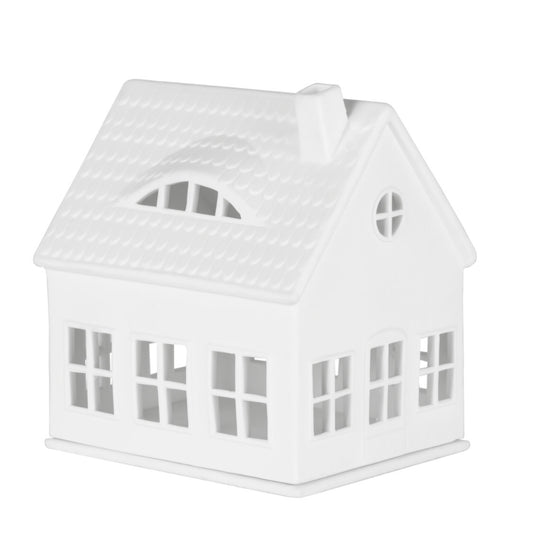 Bougeoir architectural Räder style maison avec perforations ajourées diffusant une lumière tamisée et douce