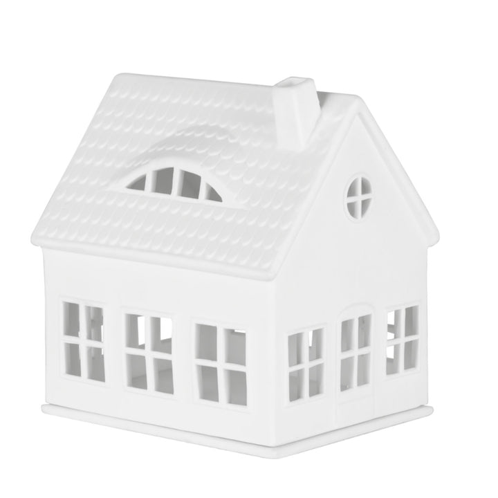 Bougeoir architectural Räder style maison avec perforations ajourées diffusant une lumière tamisée et douce