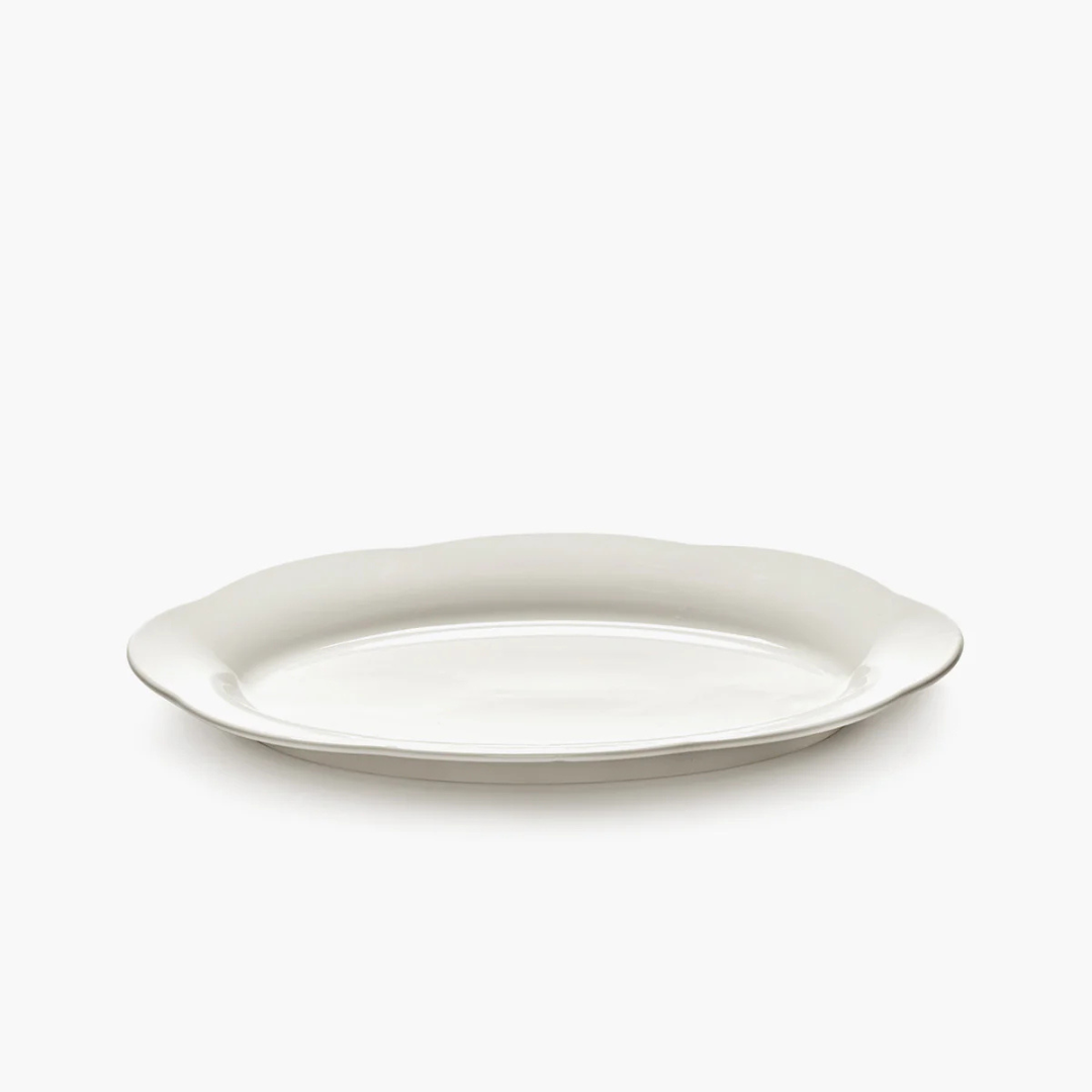 Porcelaine émaillée assiette ovale fluide design gastronomique art de table