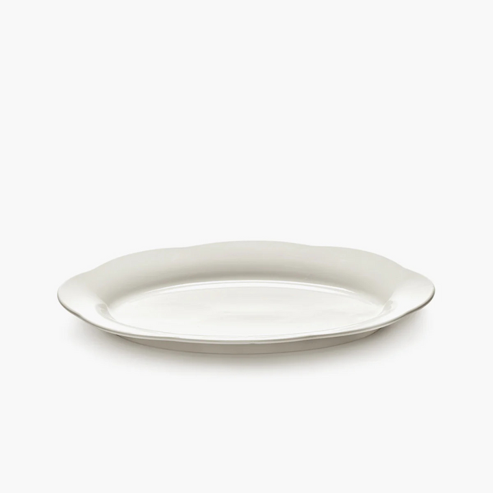 Porcelaine émaillée assiette ovale fluide design gastronomique art de table