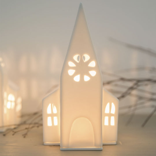 Lanterne décorative église blanche Räder en porcelaine, diffusant la lumière pour créer une ambiance chaleureuse