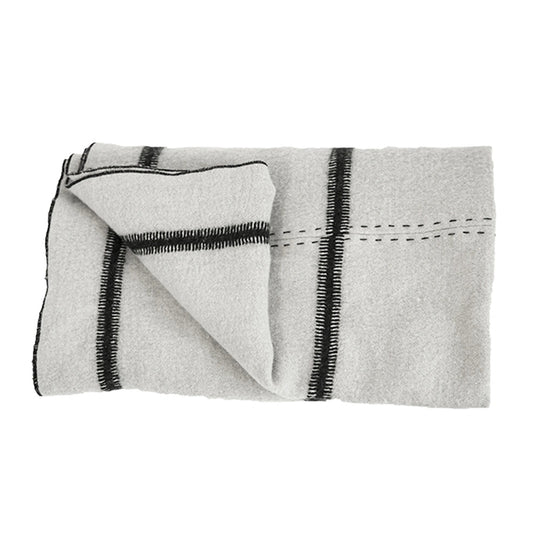 Plaid Uki Bed and Philosophy laine lin 200x100 cm drapé sur canapé design