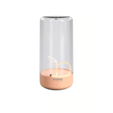 Lampe de table Pulse Sompex couleur abricot avec filament LED flottant magnétique et design épuré